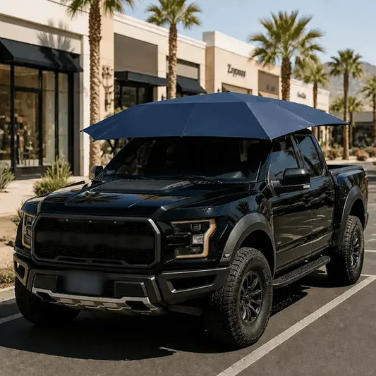 Automatic car umbrella navy blue deployed on black Ford F-150 Raptor pickup truck in sunny California outdoor parking lot