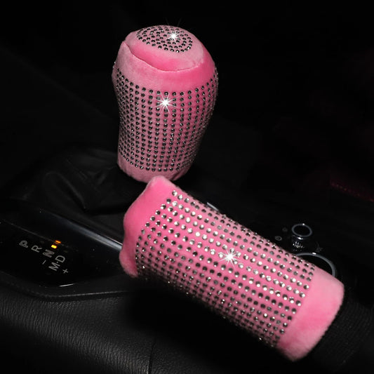Pink plush bling diamond rhinestone handbrake and gear shift cover 2pc set sparkling in dark car interior showing gear selector and handbrake both covered