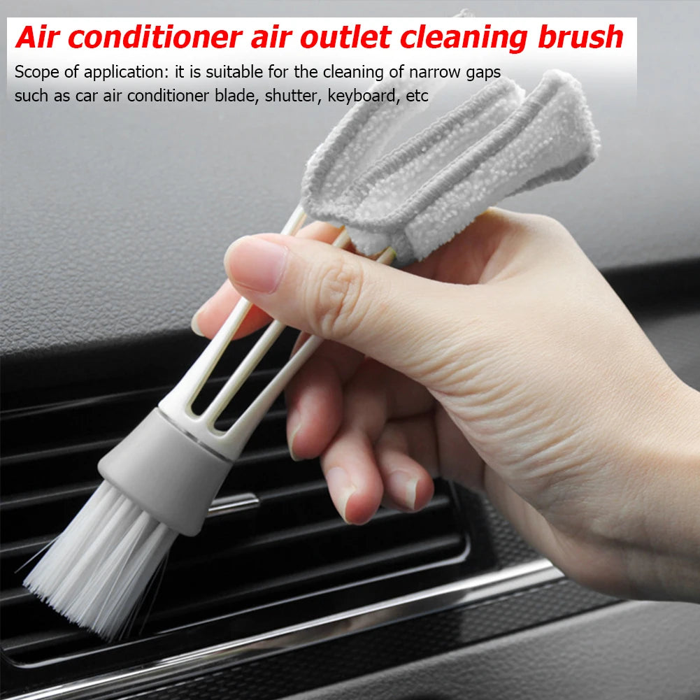 Close-up of vent dust brush removing debris from car AC outlet
