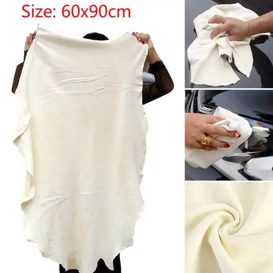 Chamois towel drying water on car hood