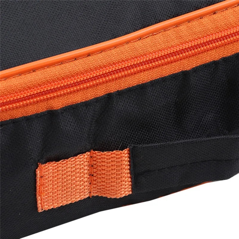Black webbing carrying handle with orange trim binding on portable storage pouch