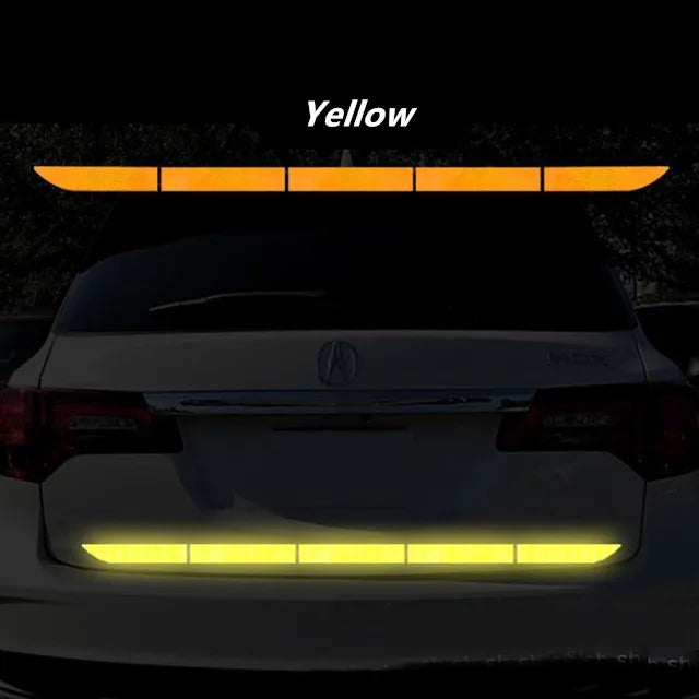 Yellow reflective rear bumper strip for improved car visibility and safety during nighttime driving