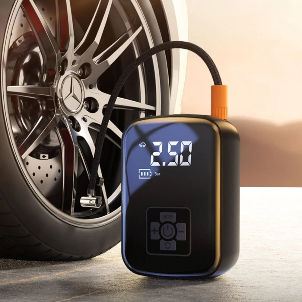 12V car air compressor connected to Mercedes tyre valve for wireless inflation beside alloy wheel