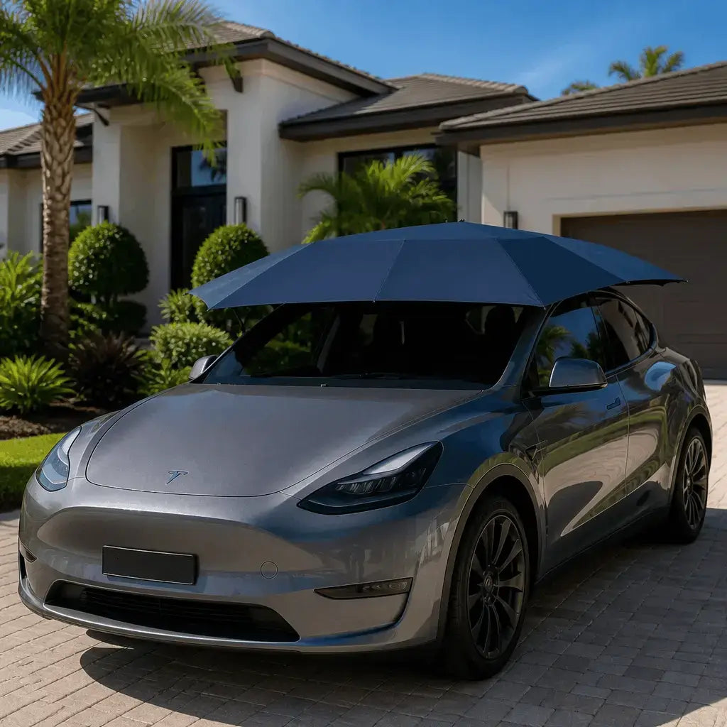 Automatic car umbrella navy blue deployed on gray Tesla Model Y electric car in luxury home driveway sun protection