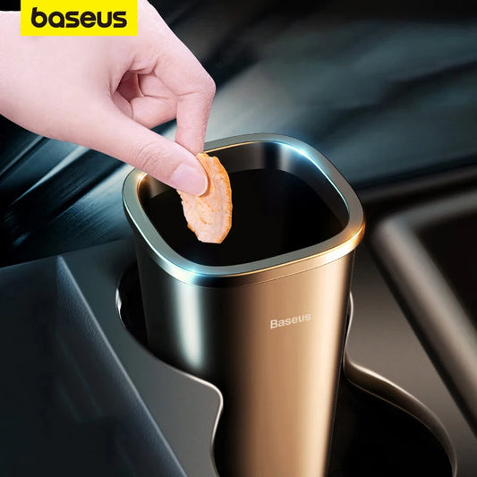 Hand dropping snack into Baseus car trash bin placed in car cupholder for easy waste disposal