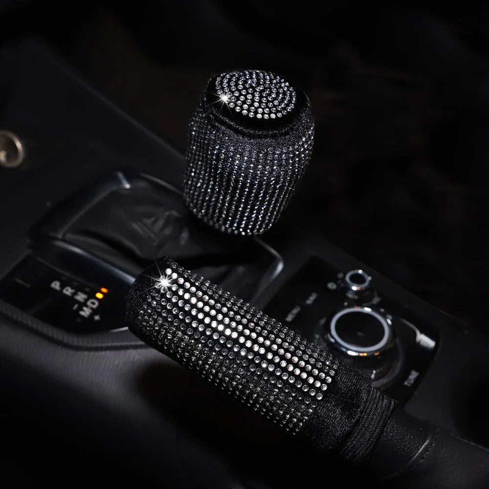 Black silver bling diamond rhinestone handbrake and gear shift cover 2pc set with silver white crystal rhinestones installed on car center console in dark interior