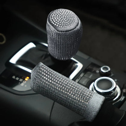 Gray plush bling diamond rhinestone handbrake and gear shift cover 2pc set installed on car center console with automatic gear selector in dark interior