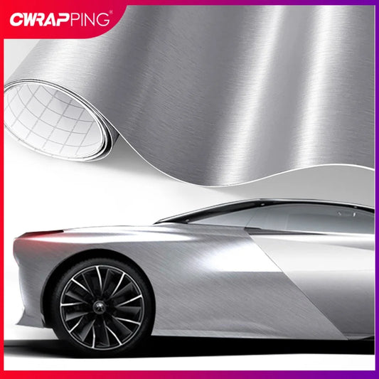 Brushed aluminum vinyl wrap applied to a silver car body for sleek exterior styling