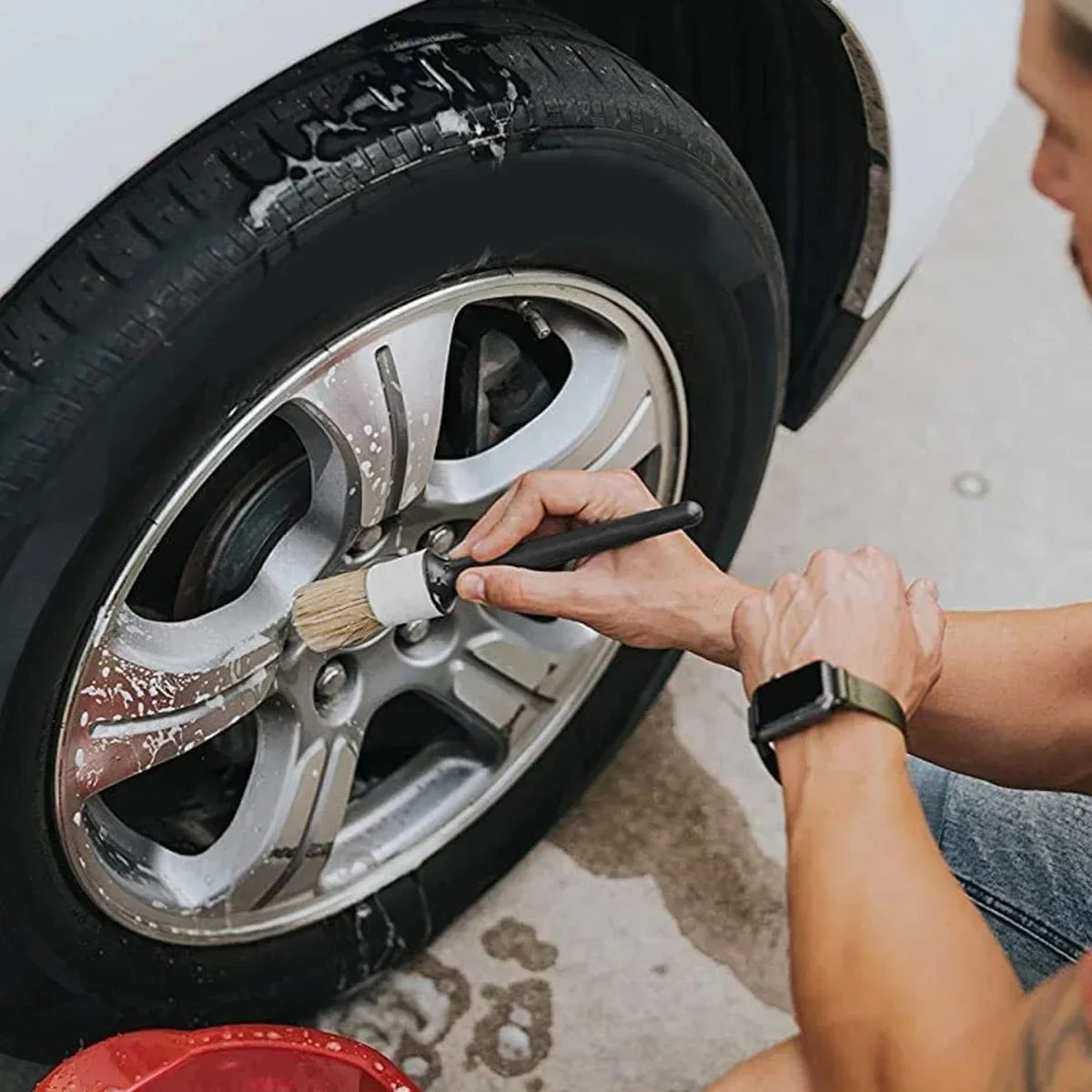 Car detailing brush cleaning soapy alloy wheel rim