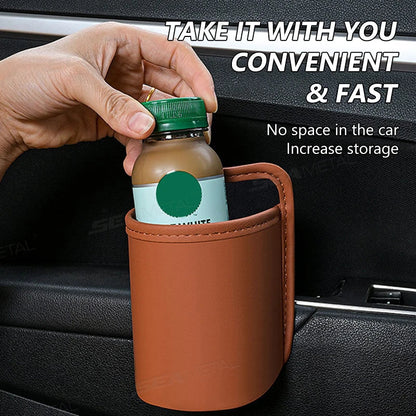 Brown small PU leather car door cup holder holding drink bottle clipped to door