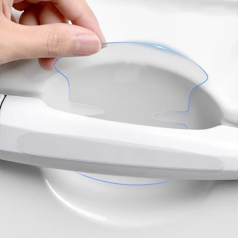 Hand peeling and applying clear PVC scratch guard film to white car door handle bowl