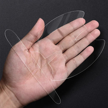 Two ultra-thin clear PVC door handle protector films held in palm showing full transparency
