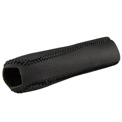 Car handbrake cover black PU leather with black hand stitching product shot on white background showing textured grip surface and open-ended tubular design