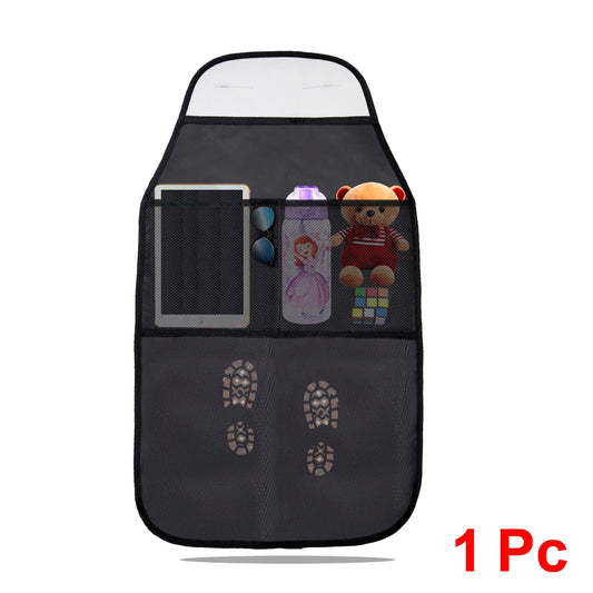 Car seat back protector with mesh storage pockets and tablet holder, shown with children's items and kick marks