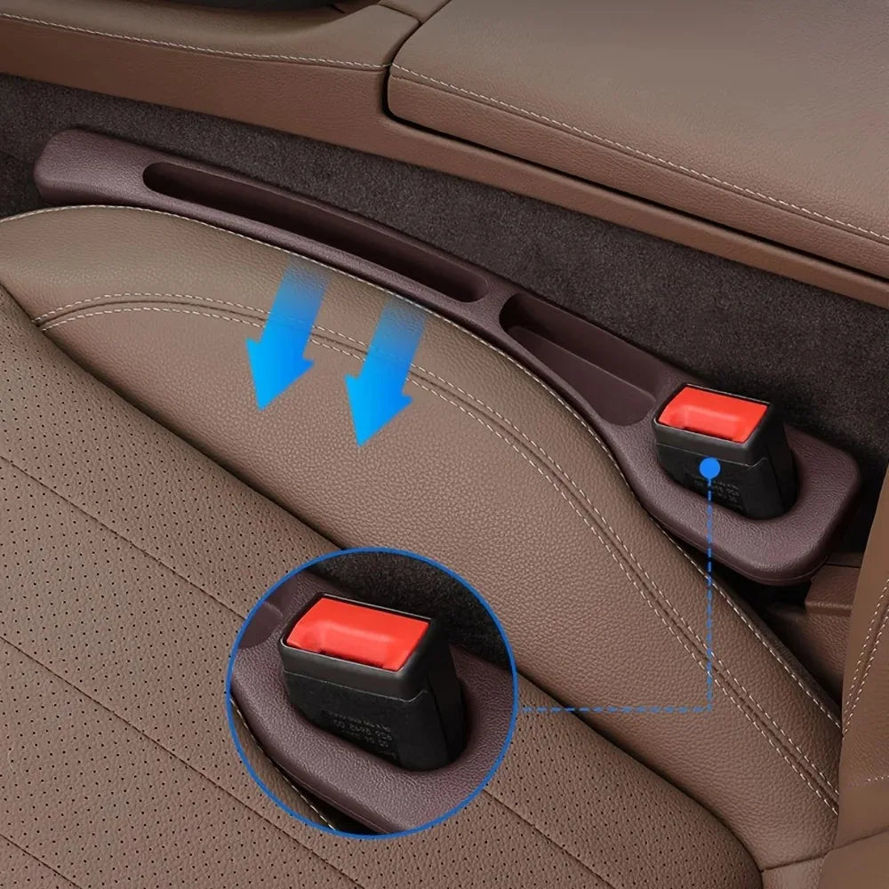 Car seat gap filler installed showing 2 groove slots with arrows and seatbelt buckle
