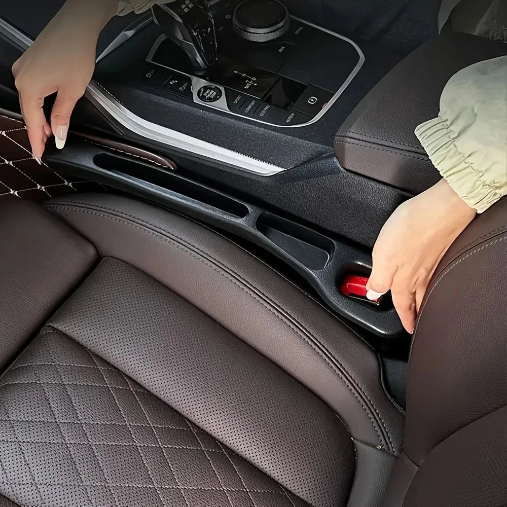 Car seat gap filler installed between seat and center console in dark leather interior