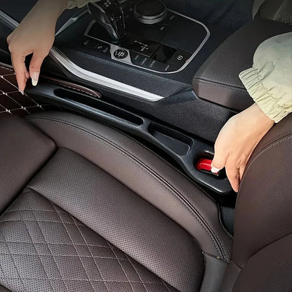 Car seat gap filler installed between seat and center console in dark leather interior