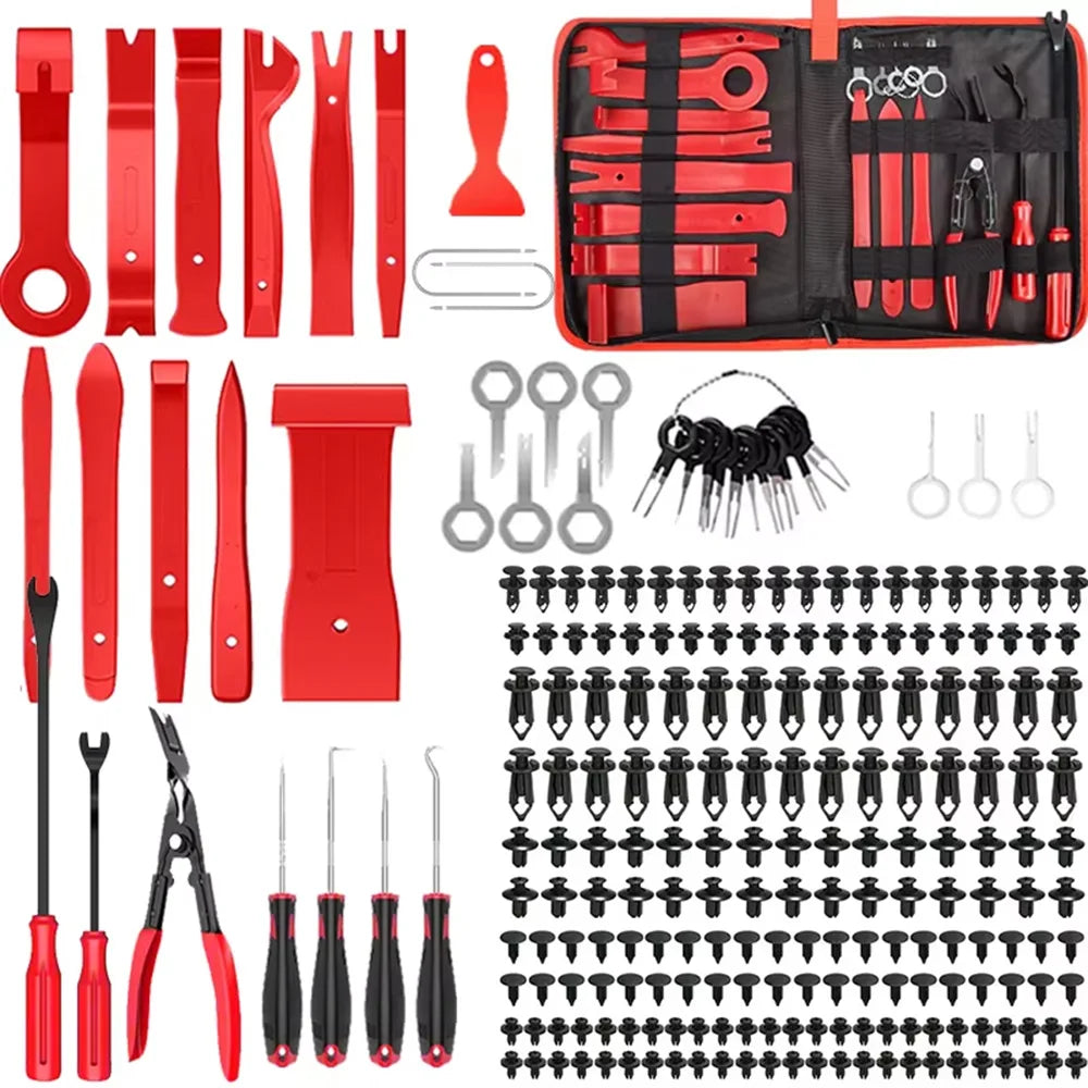 Red complete car trim removal kit contents flat lay: pry tools, picks, pliers, clips, terminals