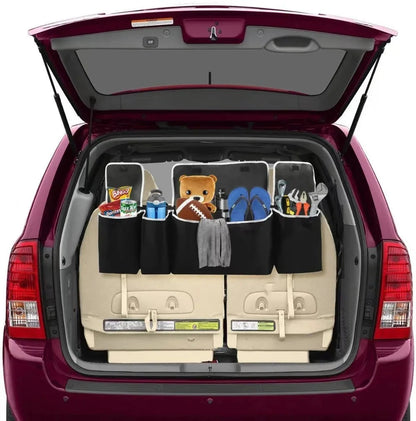 Multi-pocket trunk hanging storage organizer in maroon vehicle
