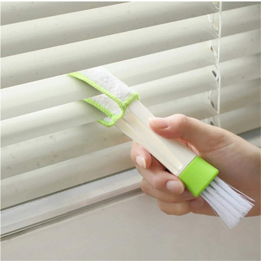 Microfiber end of double-ended brush cleaning dust from window blind slats