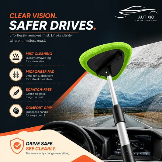 Green microfiber pad in action on a car windshield cleaning kit, pulling road mist off the glass. The extendable handle reaches across, and the pad finishes the job scratch-free, streak-free, and crystal clear.