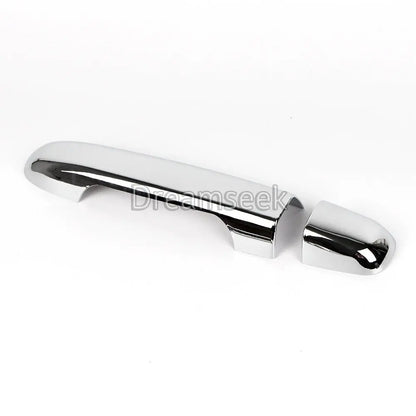Top view of chrome door handle cover aligned over existing Hyundai handle