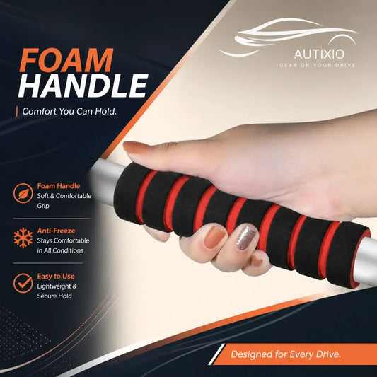 Close-up of hand gripping the soft foam anti-freeze handle on the collapsible car snow shovel