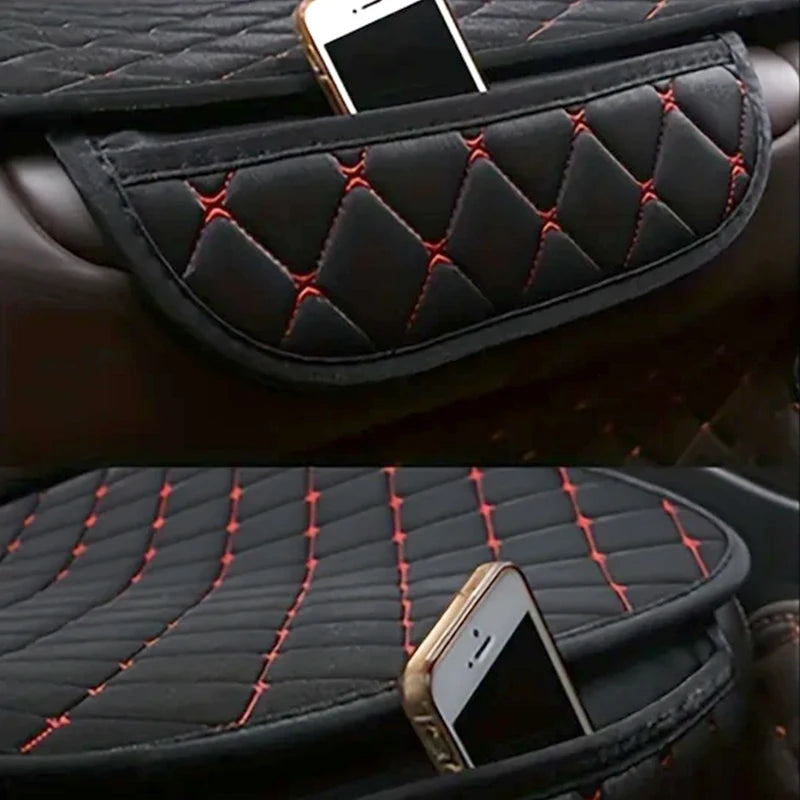 Side storage pocket on cotton linen car seat cover holding a smartphone, black with red stitching detail