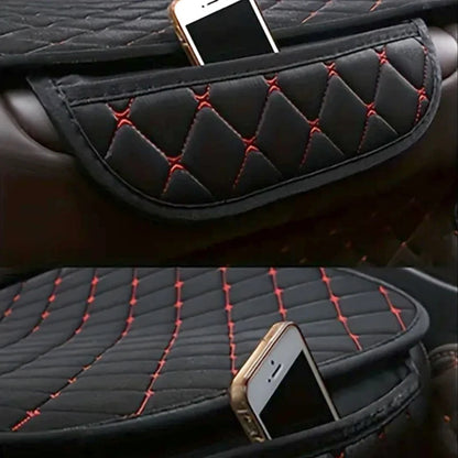 Side storage pocket on cotton linen car seat cover holding a smartphone, black with red stitching detail