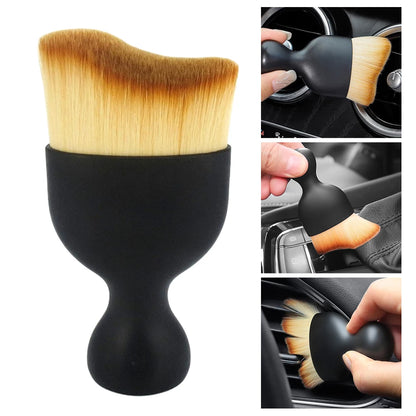 Detailing brush in use on center dash panel – perfect for fine dust removal