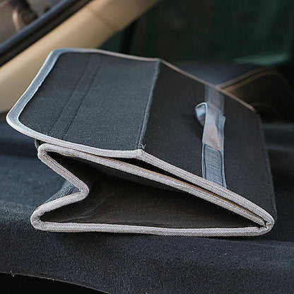 Felt trunk organizer folded flat on car floor showing space-saving foldable design