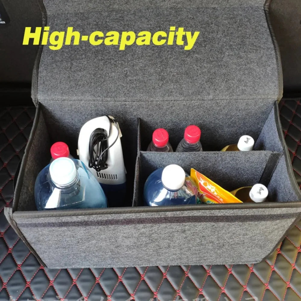 Felt trunk organizer open with lid up showing interior dividers filled with bottles and supplies
