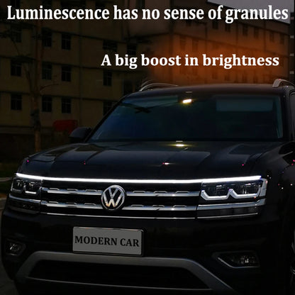 Flexible LED hood strip glowing white along vehicle front edge