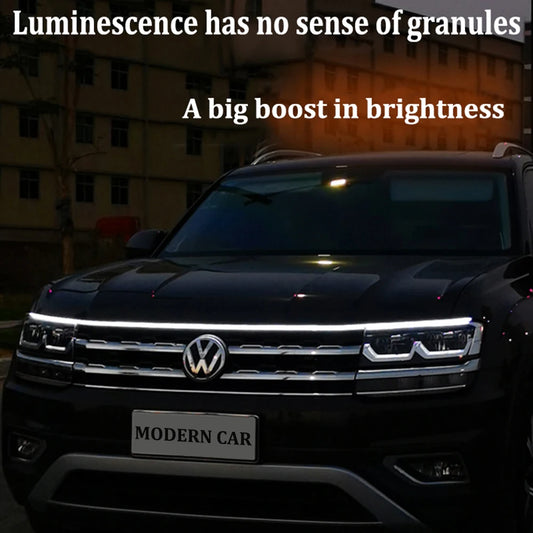 Flexible LED hood strip glowing white along vehicle front edge