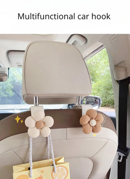 Installation guide showing how to attach flower car decoration to seat hook