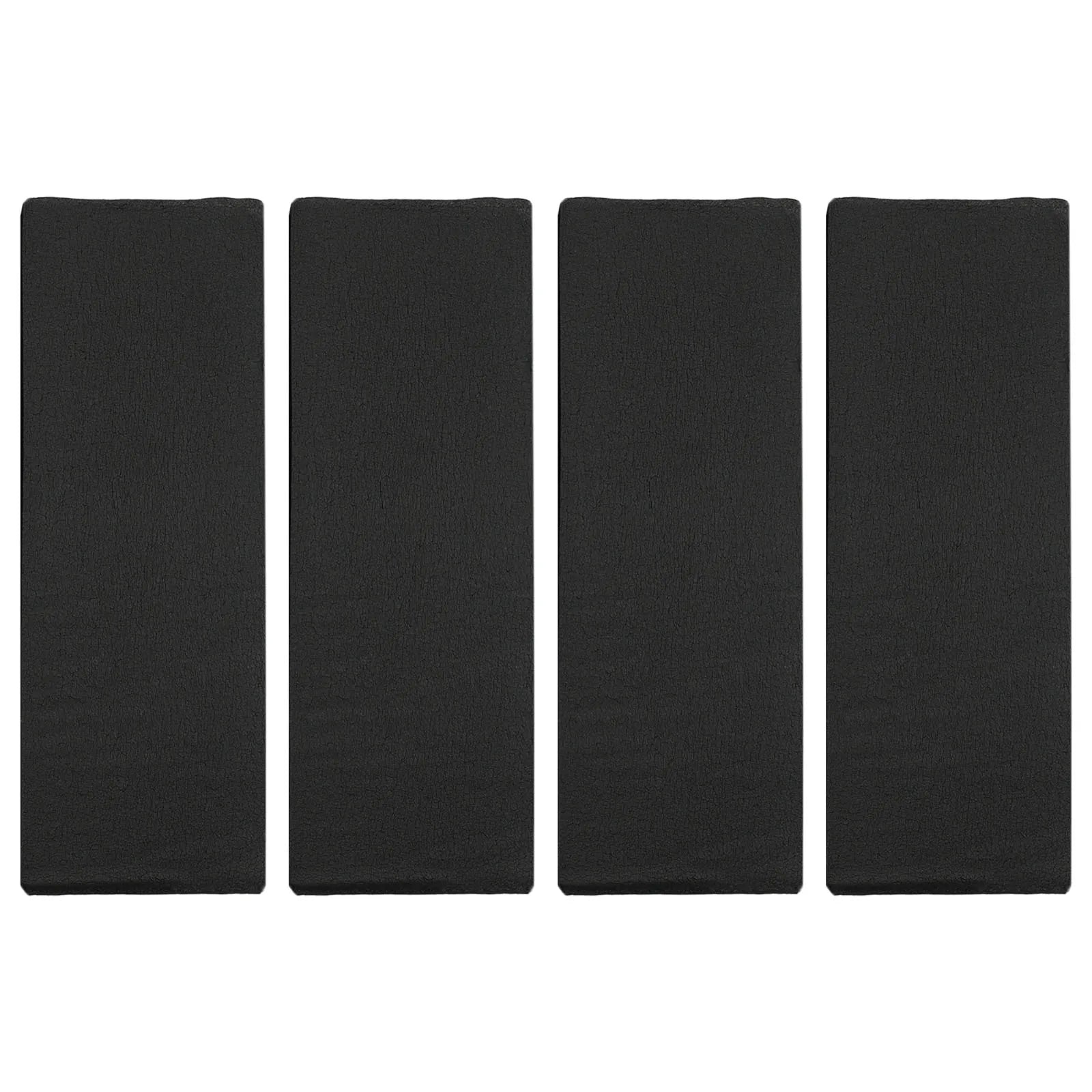 4 black foam garage wall bumper pads standing upright showing front surface texture