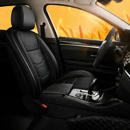 Black heated car seat cushion single seat installed in car interior with golden autumn background