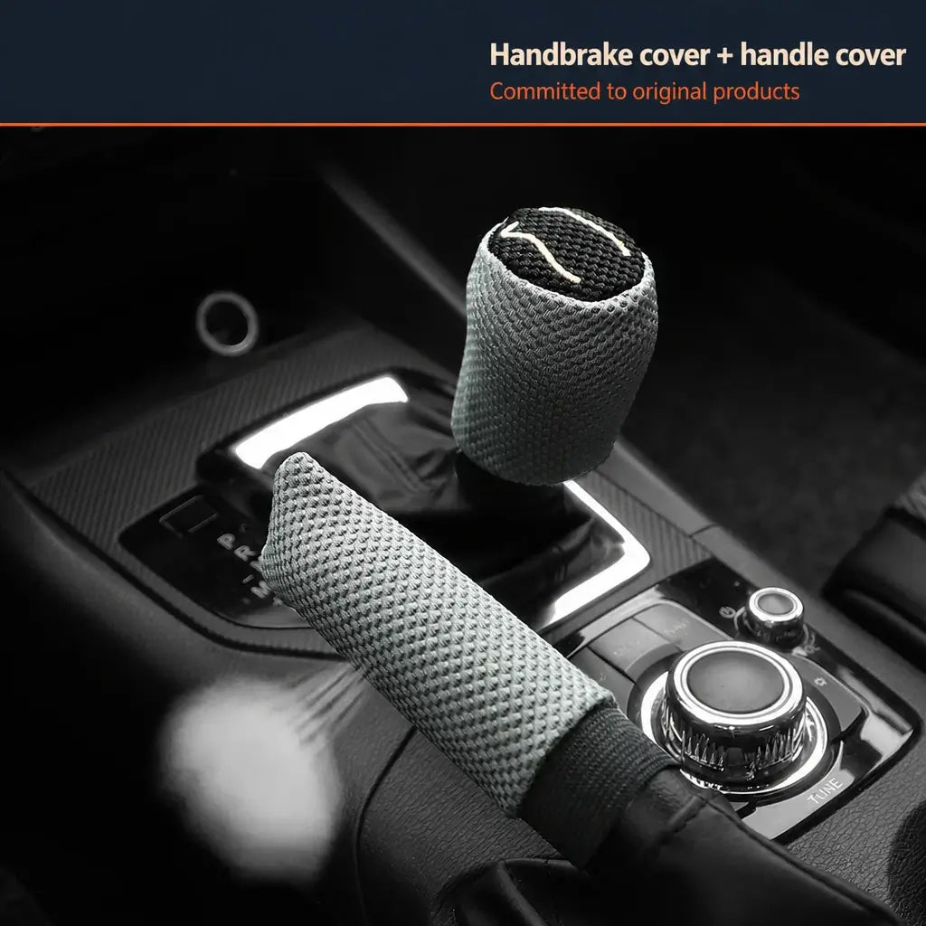 Gray ice silk breathable handbrake and gear shift cover 2pc set installed on car center console with dark Audi style interior