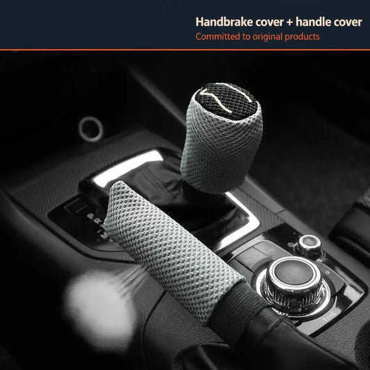 Gray ice silk breathable handbrake and gear shift cover 2pc set installed on car center console with dark Audi style interior