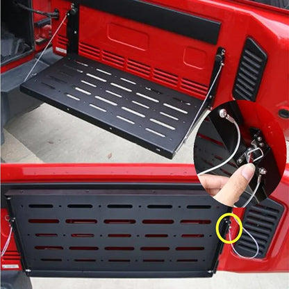 Tailgate cargo tray in use holding gear – ideal for camping and off-road setups