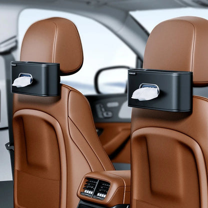 Leather tissue holder hanging from car headrest post on the seat back