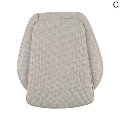 Beige perforated leather car seat height cushion front row top-down view on white background