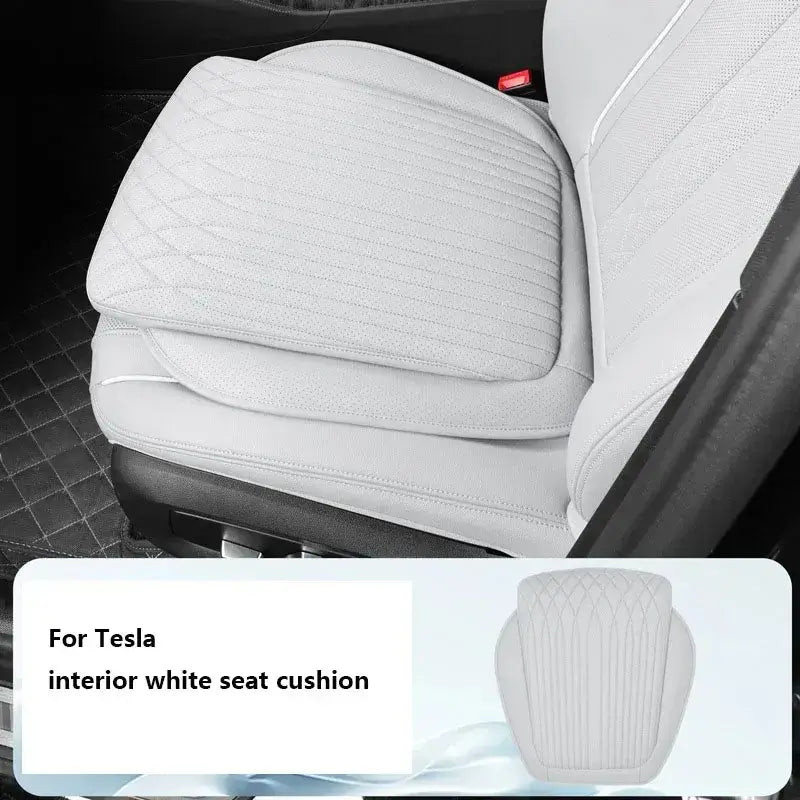 White leather car seat height cushion installed on Tesla white interior front seat with quilted diamond stitch design