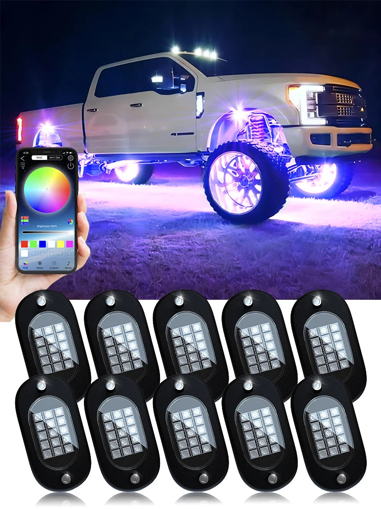 10-pod RGB rock lights kit with app — lifted truck with pink underglow