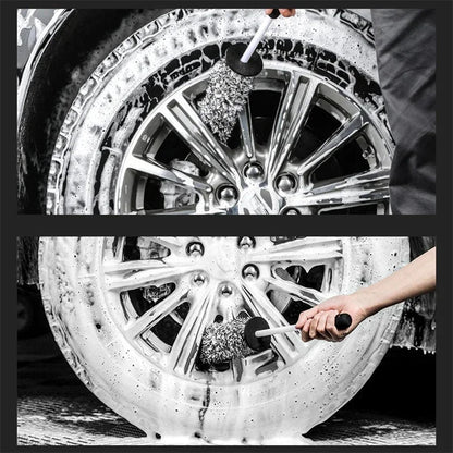 Microfiber wheel brush scrubbing soapy alloy rim from two angles with foam and suds