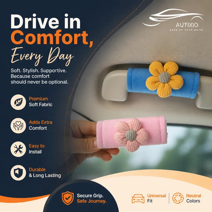 Blue and pink plush car grab handle covers with daisy flower decor installed on car roof handles, highlighting premium soft fabric, secure grip, and easy install