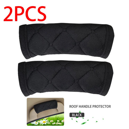 Two black quilted plush car roof handle protective sleeves 2PCS set on white background