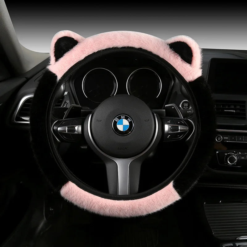 Plush cat ear steering wheel cover black with pink top section and ears installed on BMW steering wheel