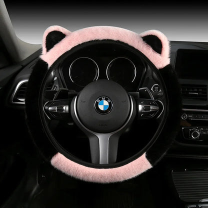 Plush cat ear steering wheel cover black with pink top section and ears installed on BMW steering wheel