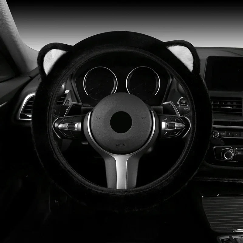 Plush cat ear steering wheel cover black with white ear tips installed on car steering wheel